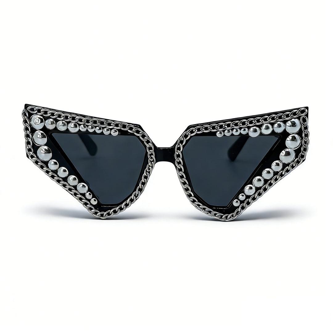 Dame solbrille med unik trekantet ramme og glitrende accenter Skanto