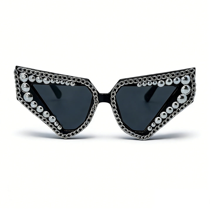 Dame solbrille med unik trekantet ramme og glitrende accenter Skanto
