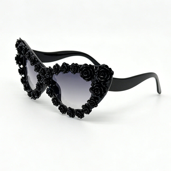 Damen hjerteformet solbrille med blomsterapplikasjon Skanto