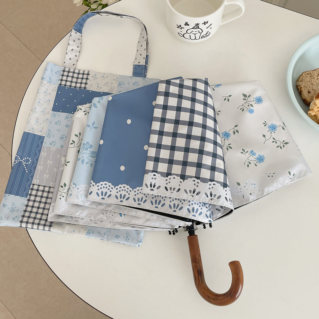 Damer paraply i romantisk patchwork-design Skanto