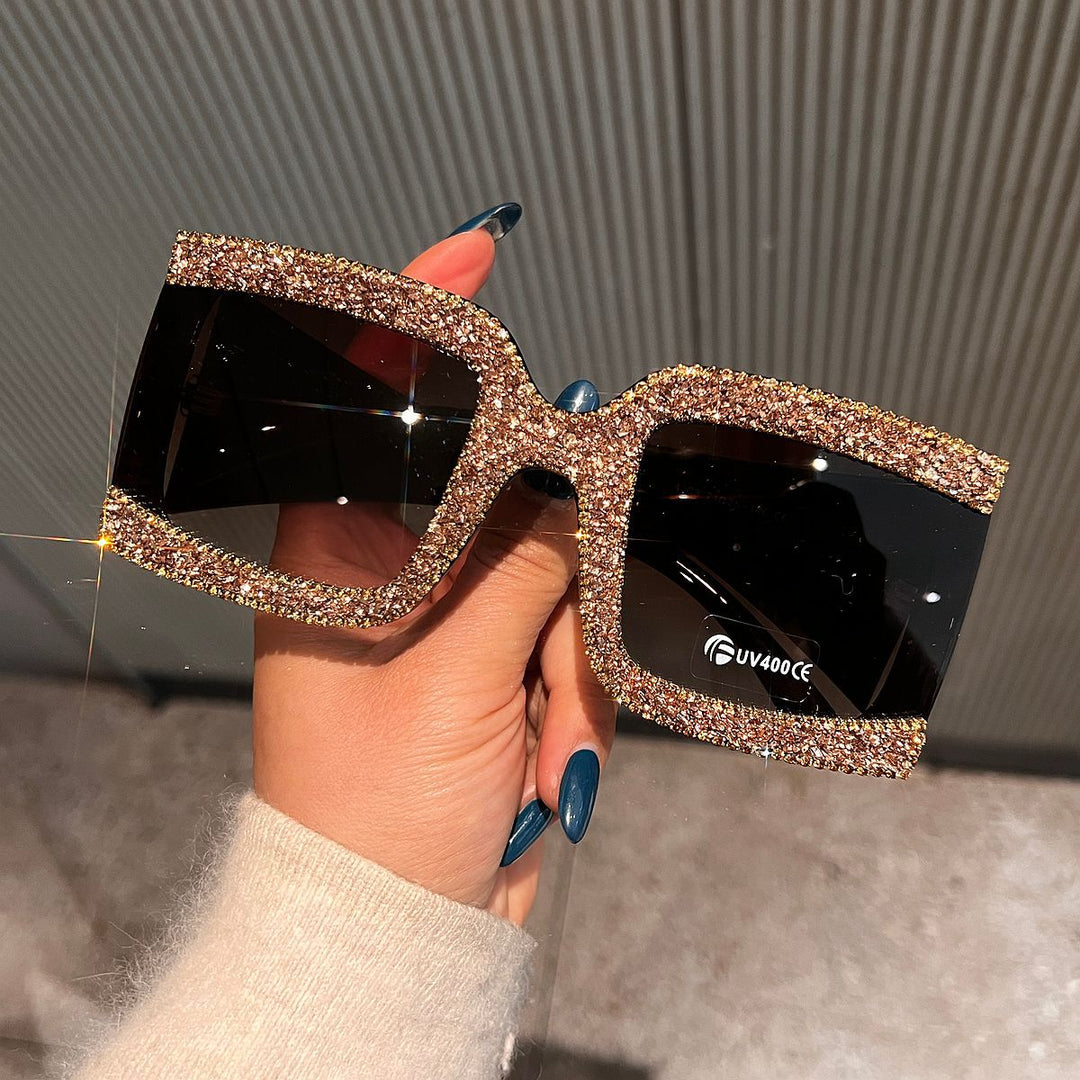 Dame solbrille med strassdekorert ramme Skanto
