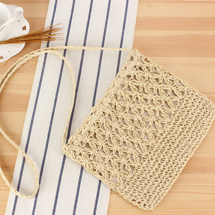 Hand-knotted shoulder bag with floral details Skanto