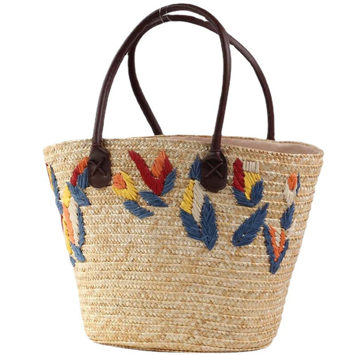 Braided beach bag with colorful embroidery pattern Skanto