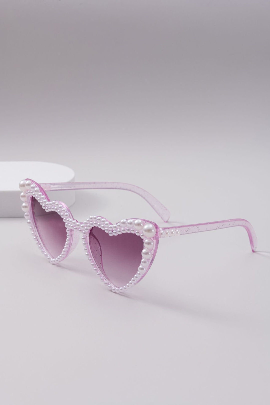 Dame designer solbrille med perleinnramming fra Skanto