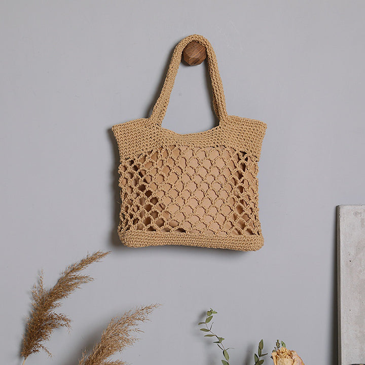 Håndlaget bæreveske i moderne nettdesign Skanto