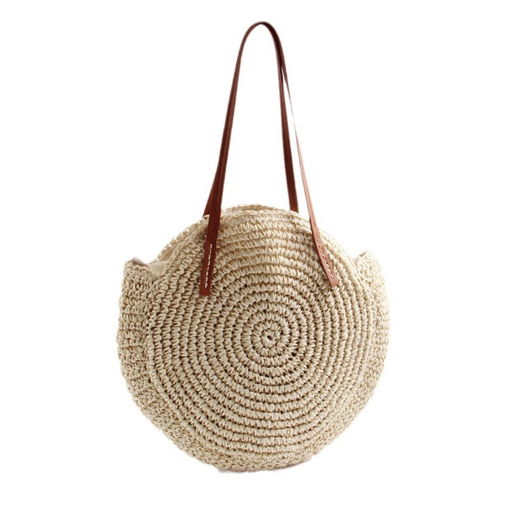 Round straw bag with elegant leather handles Skanto