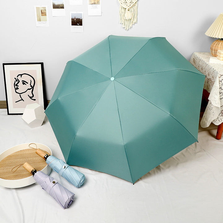 Damer elegant foldbar paraply i høyden med stilfullt trehåndtak Skanto