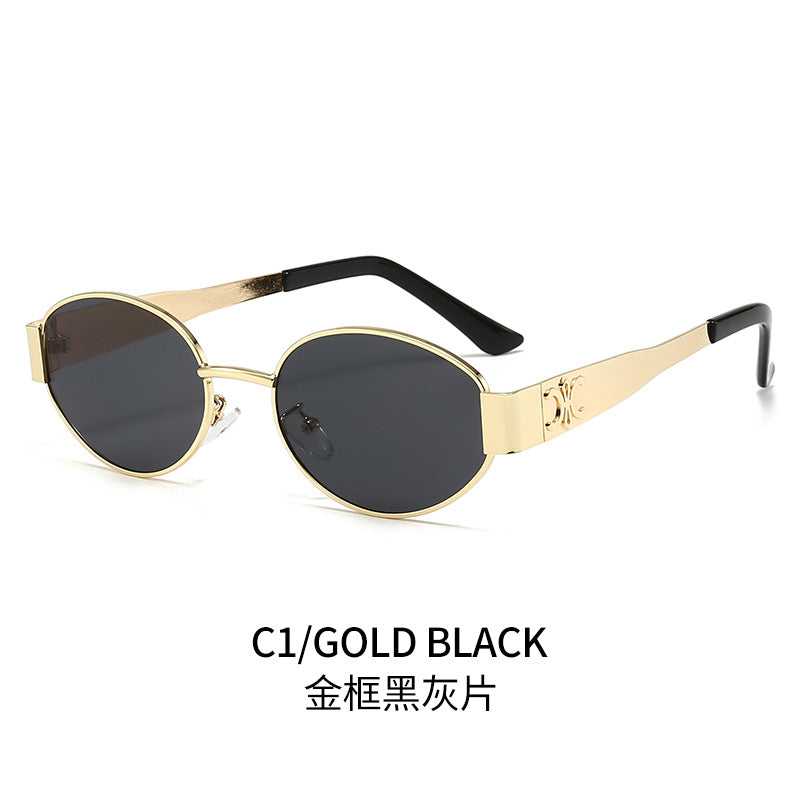 Dame Designer-solbrille med elegant oval ramme og unike aksenter Skanto