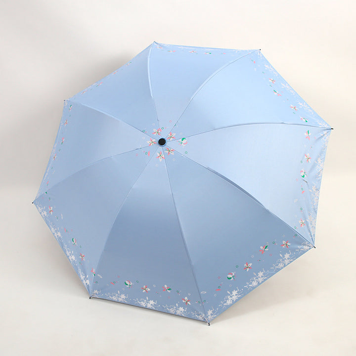 Kvinnens sammenleggbare paraply med blomstermønstre Skanto