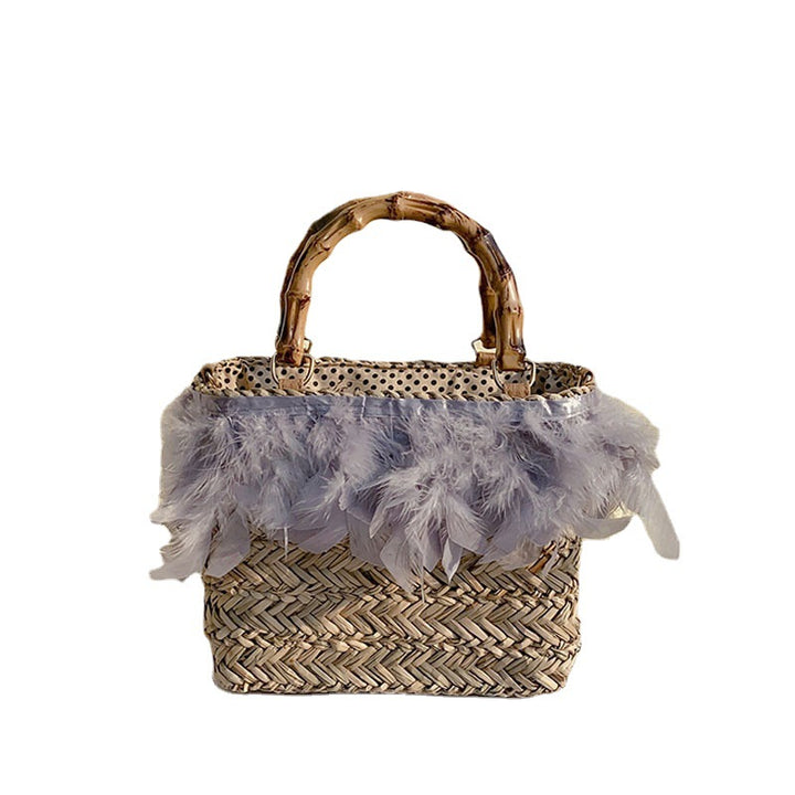 Elegant handbag with feathers and bamboo handle Skanto