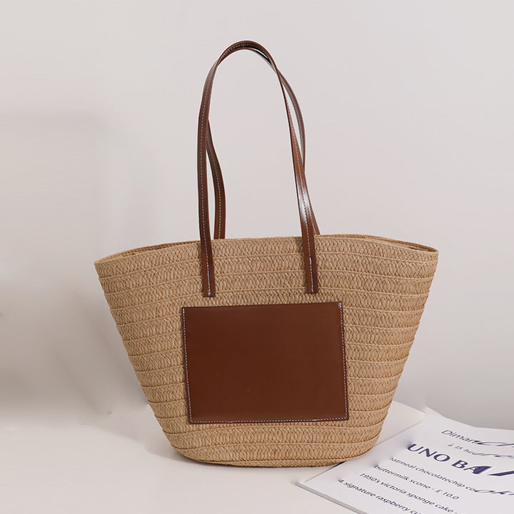 Elegant straw bag with stylish leather details Skanto