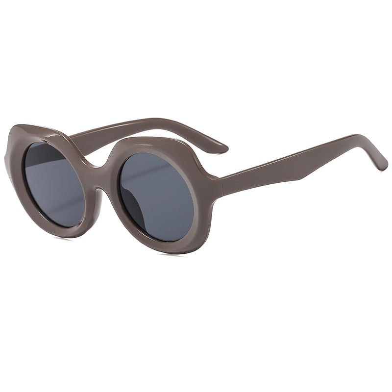 Dame oversized solbriller med stilige, buede rammer Skanto