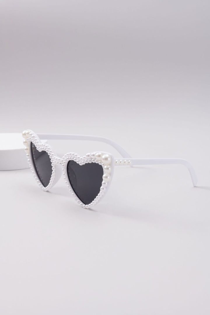 Dame designer solbrille med perleinnramming fra Skanto