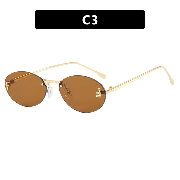 Dame mote trendy solbriller med elegante, runde glass og filigran metallramme Skanto