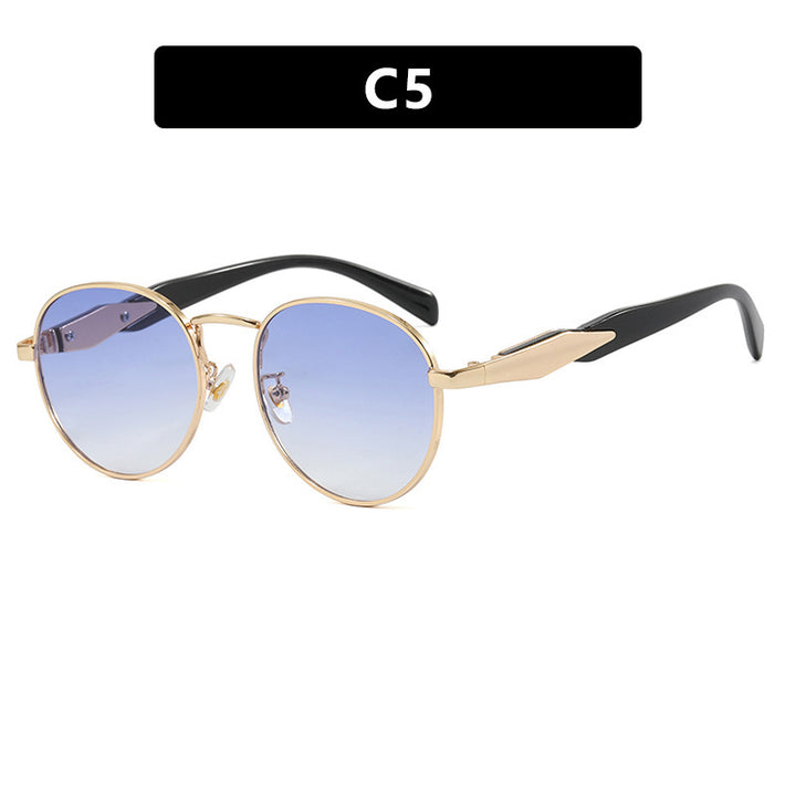 Dame rund solbrille med elegant, gullramme og UV-beskyttelse Skanto
