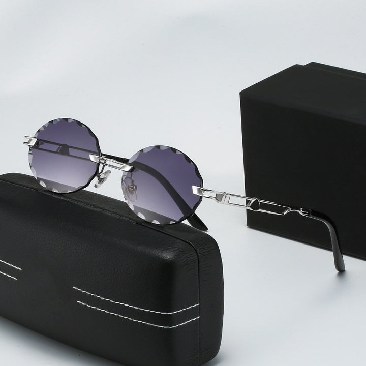 Dame rund solbrille med unikt bølgedesign og høykvalitets metallramme Skanto