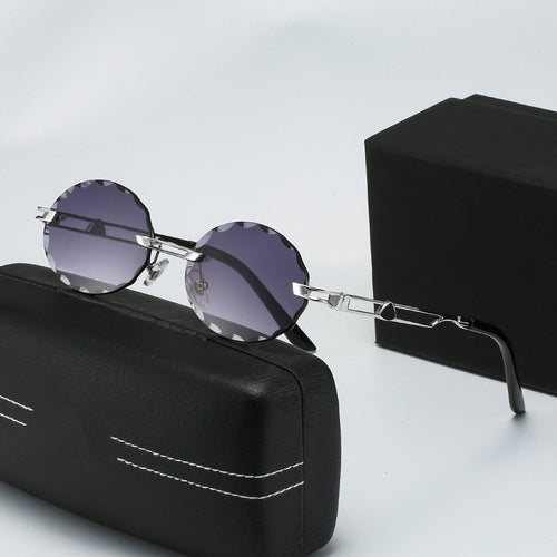 Dame rund solbrille med unikt bølgedesign og høykvalitets metallramme Skanto