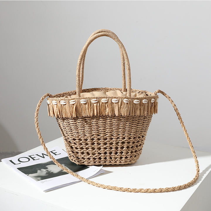 Braided straw bag with decorative tassel detail Skanto