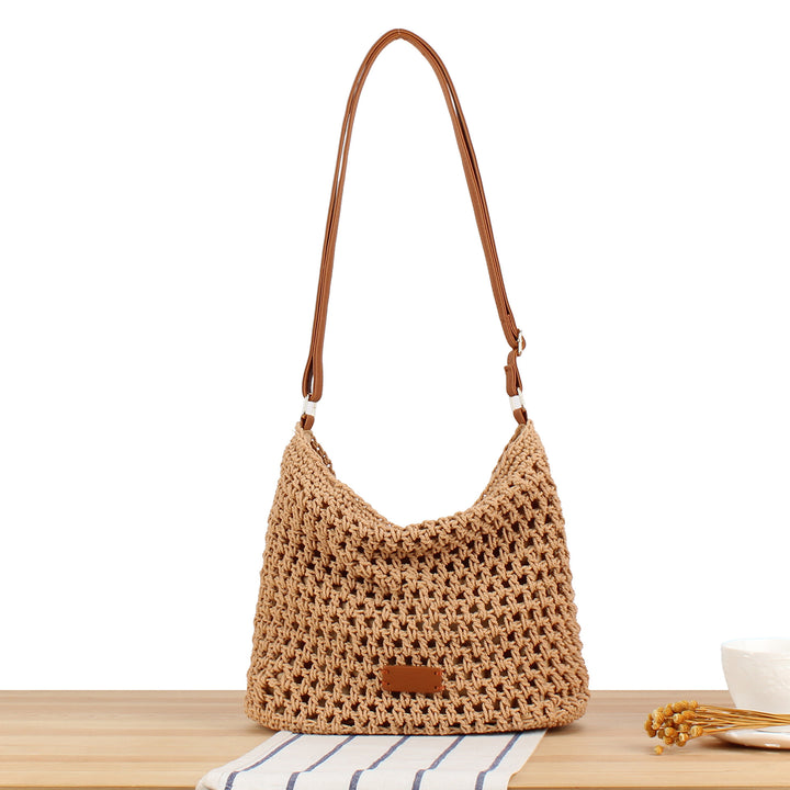 Handbag in hand-woven natural material with leather accents Skanto