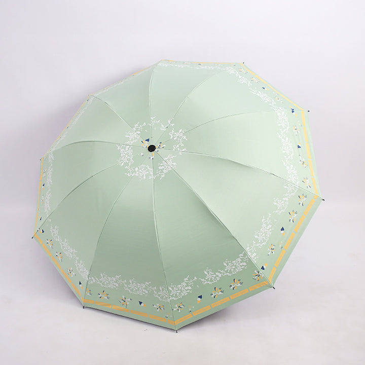 Kvinnens elegante sammenleggbare paraply med blomsterdesign Skanto