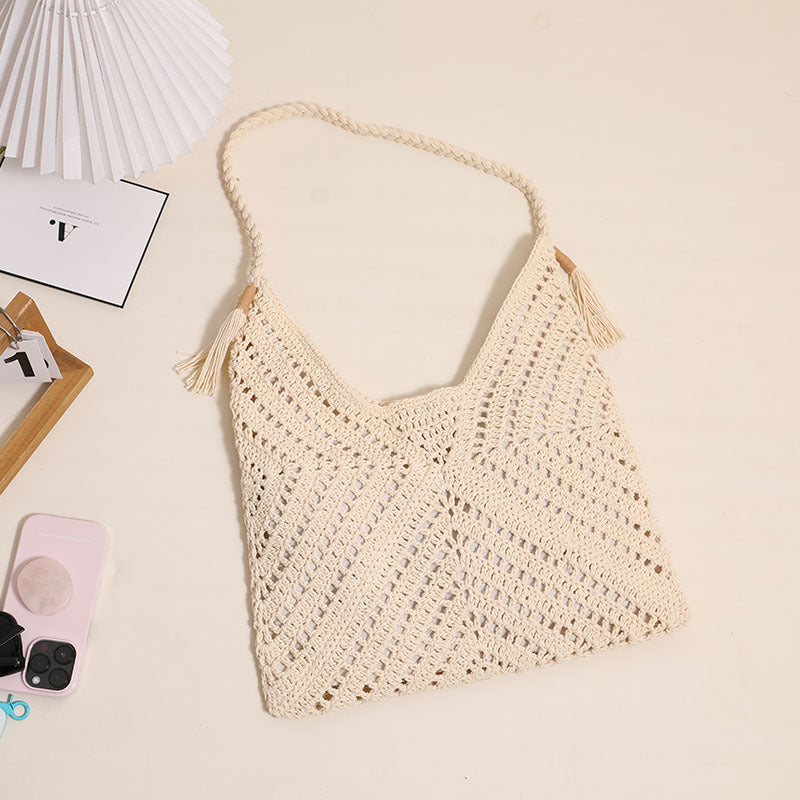 Handmade macrame shoulder bag with playful tassels Skanto