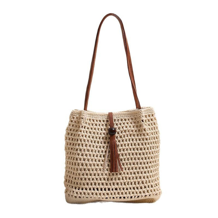 Hand-knotted basket bag with elegant leather handle Skanto