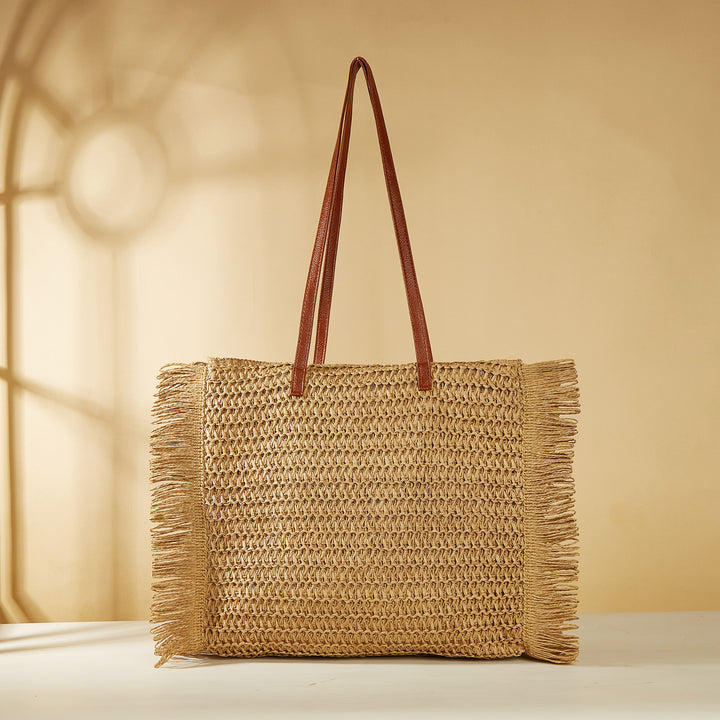 Strandveske i raffia med frynse-detaljer Skanto