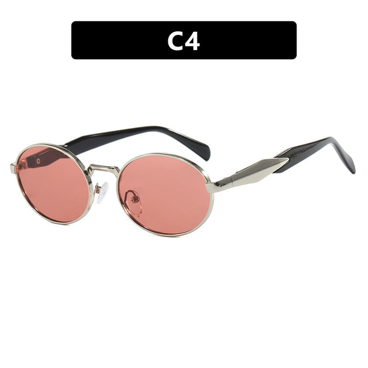 Dame moteriktig solbrille i elegant ovaldesign med trendy detaljer Skanto