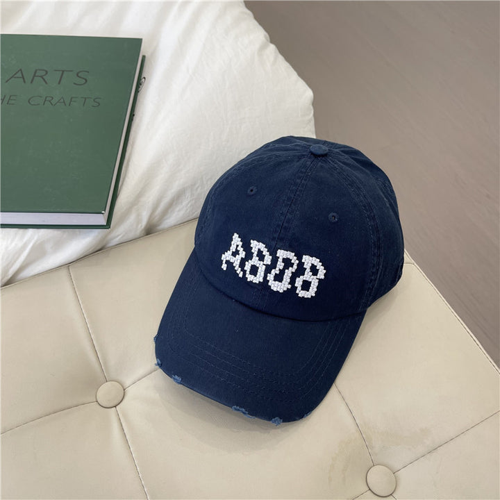 Kvinnens slitte bomull baseballcaps med grafisk detaljer Skanto