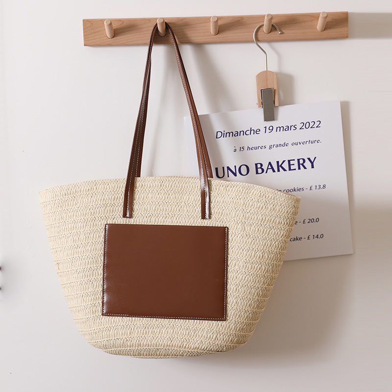Elegant straw bag with stylish leather details Skanto