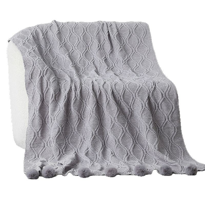 Dame strikket teppe med dekorative pom poms Skanto