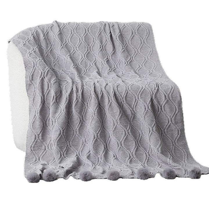 Dame strikket teppe med dekorative pom poms Skanto