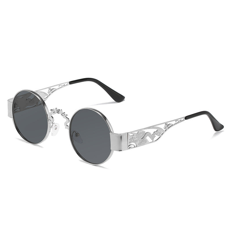 Dame kunstnerisk rundt solbrille med elegant filigranramme Skanto