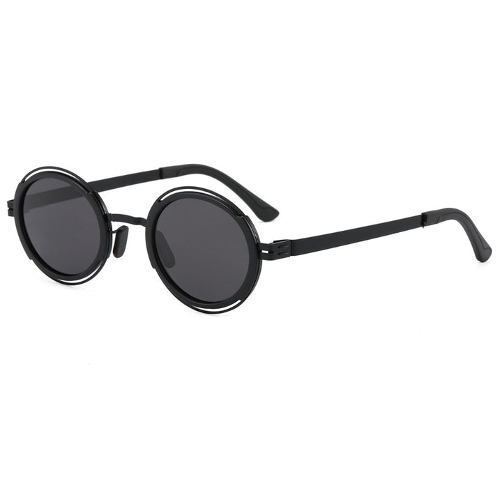 Damer moteriktig rund solbrille med elegant metallramme Skanto