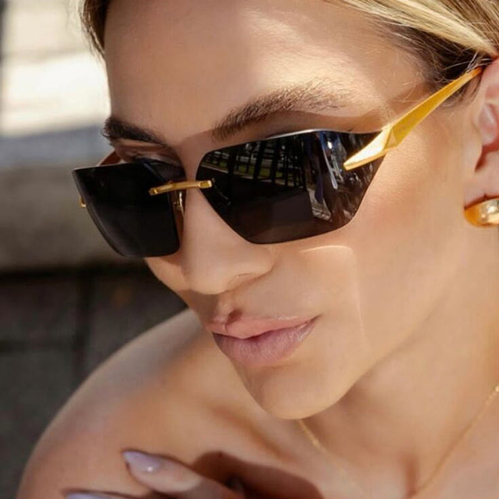 Damer geometrisk solbrille med elegant metallramme og polarisert glass Skanto