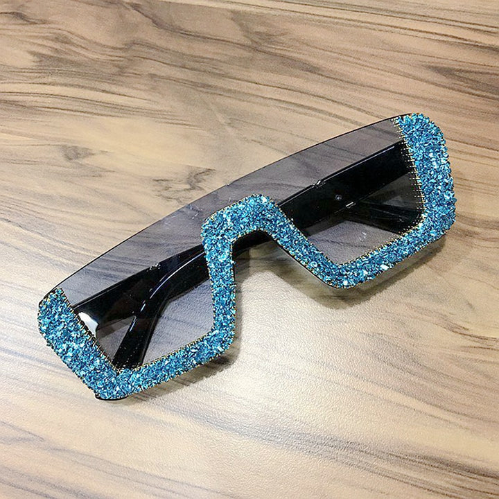 Dame elegant glitter-solbriller med markant ramme Skanto