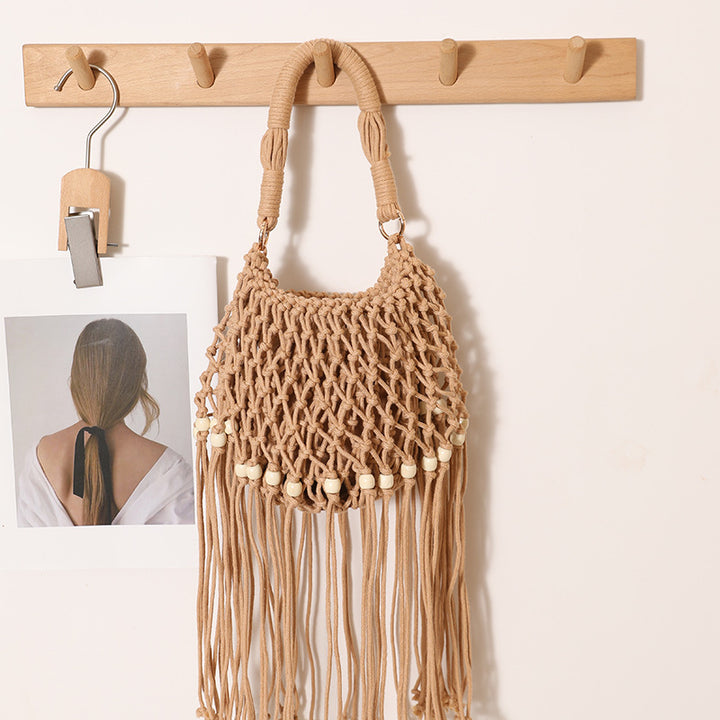 Macrame bag with decorative fringes and wooden beads Skanto