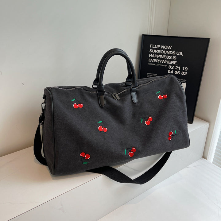 Sporty weekend bag with playful cherry pattern Skanto