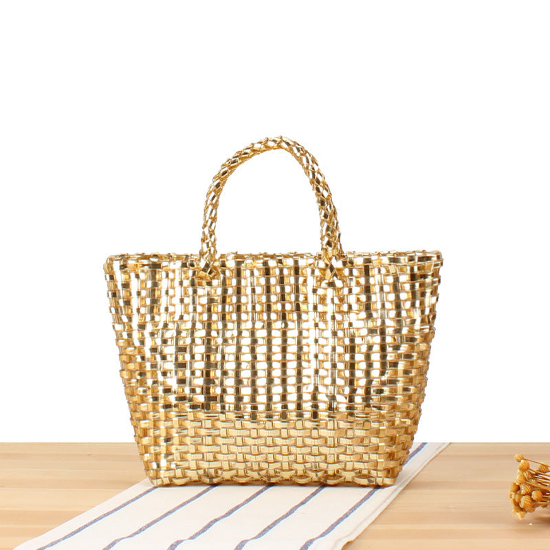 Handbag made of woven natural material with elegant accents Skanto