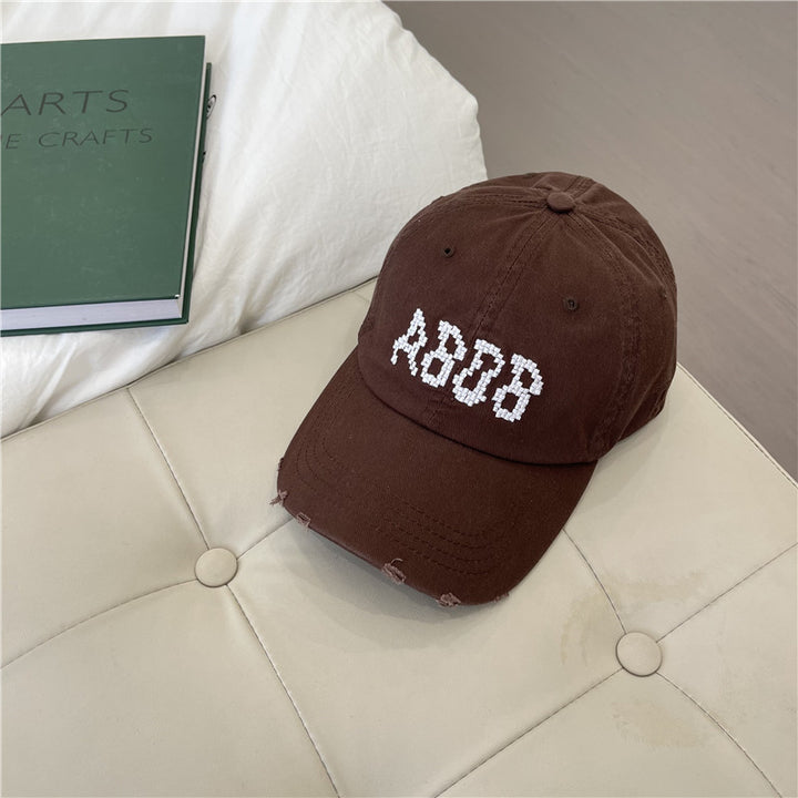 Kvinnens slitte bomull baseballcaps med grafisk detaljer Skanto