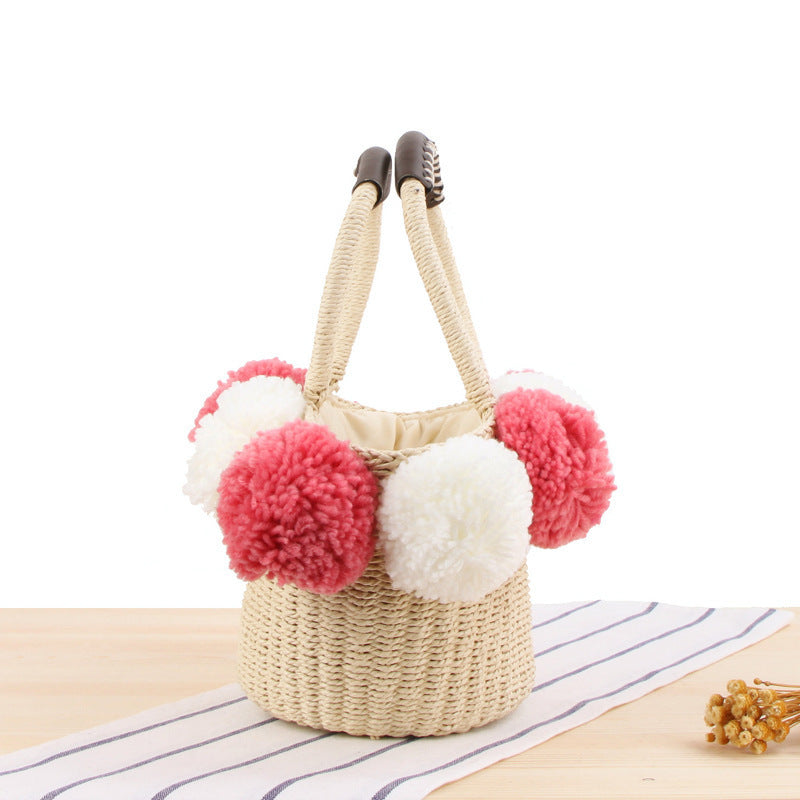 Basket bag with pompom decorated top Skanto