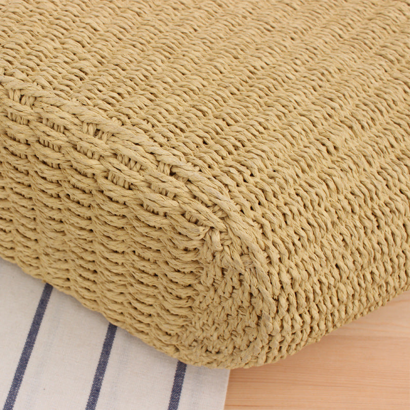Woven natural material handbag with elegant leather handles Skanto