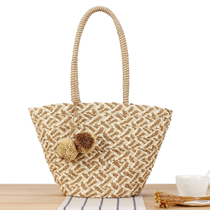 Modern basket bag with decorative pom poms Skanto