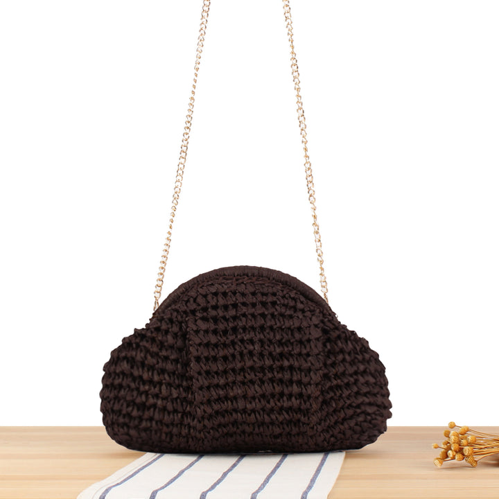Shoulder bag made of handmade natural fibers with elegant chain embellishment Skanto