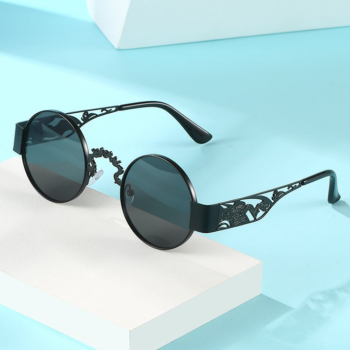 Dame kunstnerisk rundt solbrille med elegant filigranramme Skanto