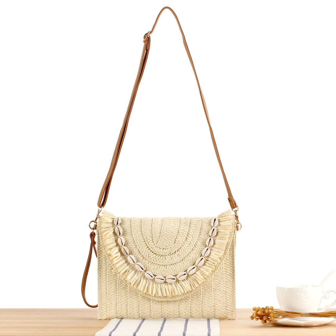 Shoulder bag with hand-knotted shell decor Skanto