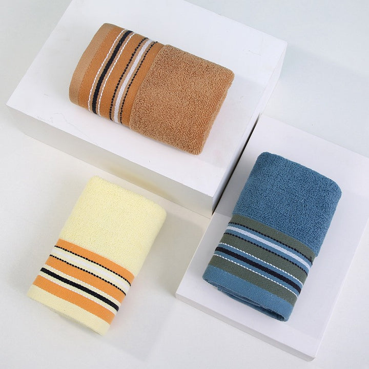 Premium Frottéhåndkle med elegant striperåndbord.