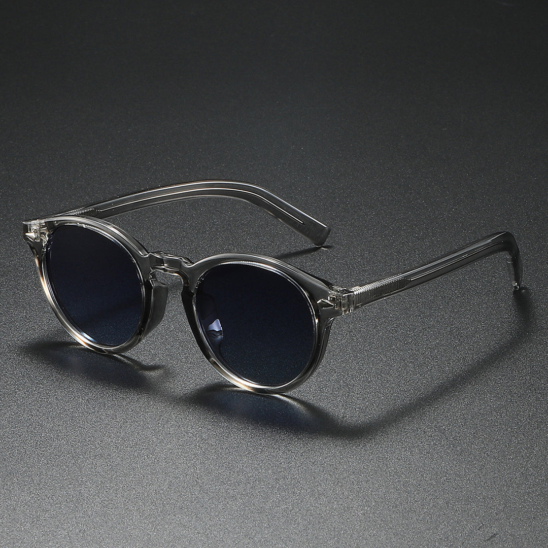Dame Rund-solbrille med transparent ramme og reflekterende glass Skanto