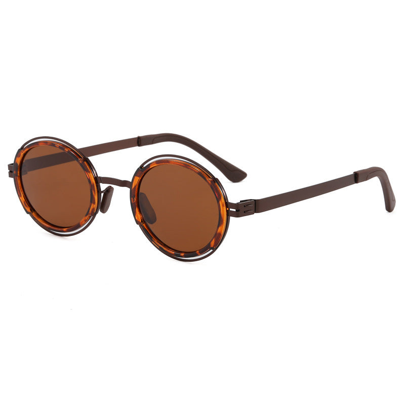 Damer moteriktig rund solbrille med elegant metallramme Skanto
