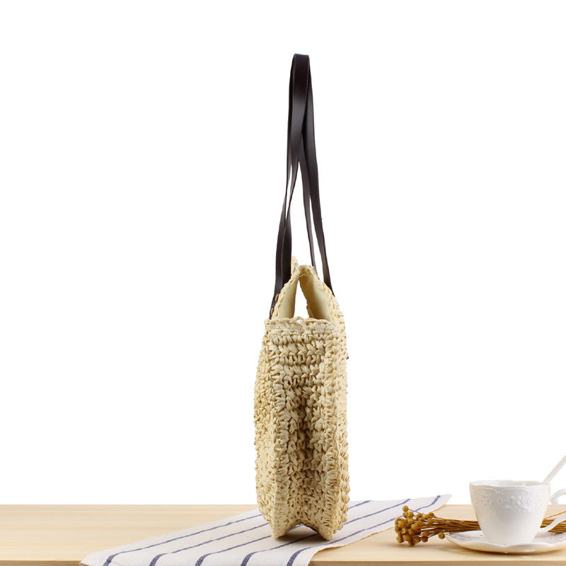 Round basket bag with sturdy leather handles Skanto